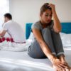 Stressed couple having cramping after sex problems.